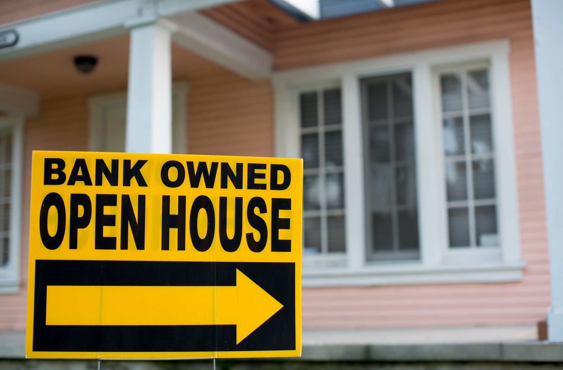 Bank Owned Open House Sign. In Front of a Home